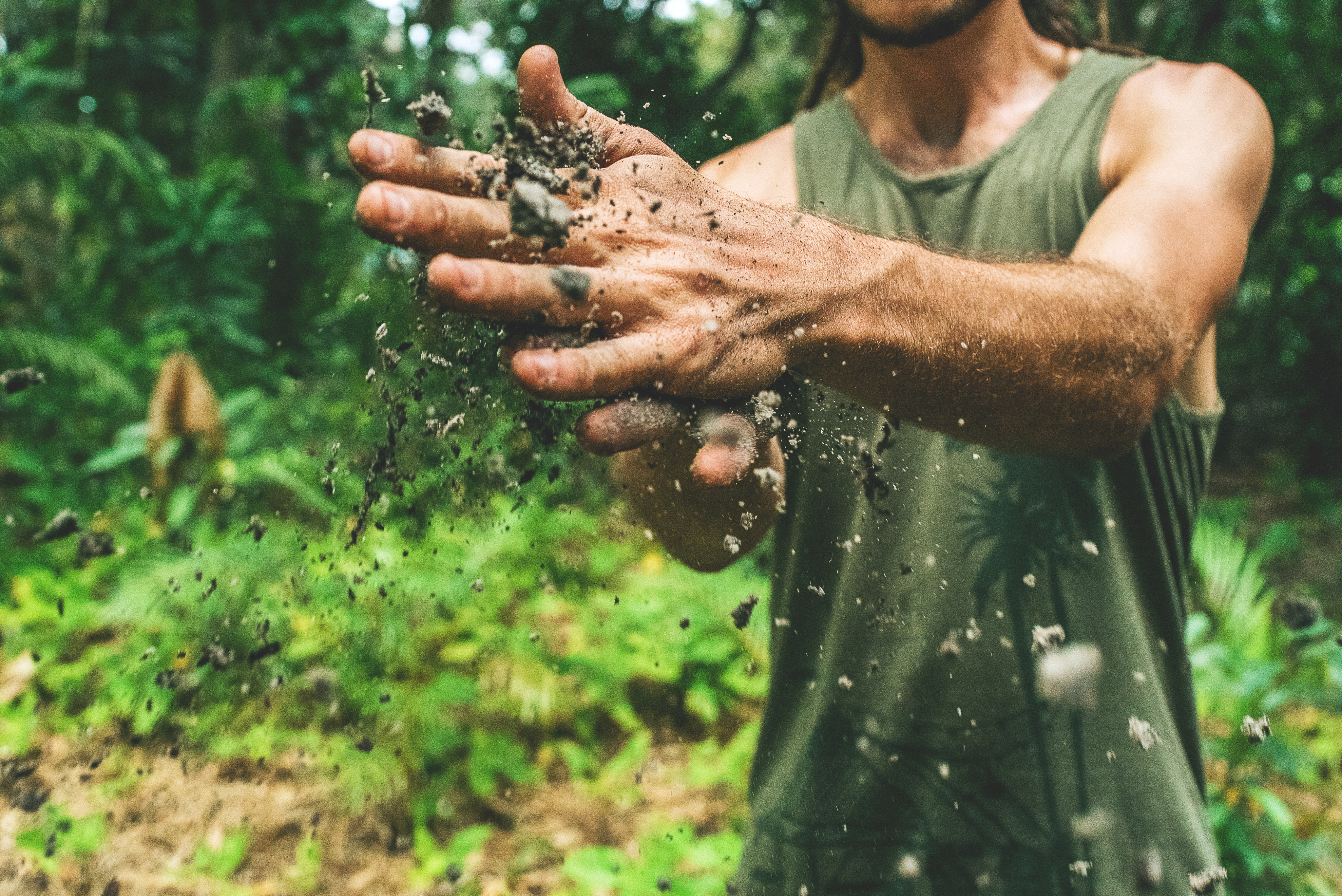 man in field with sand